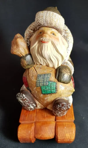 Santa Claus riding his sled